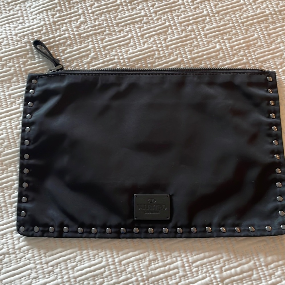 Valentino clutch/ travel necessary.
